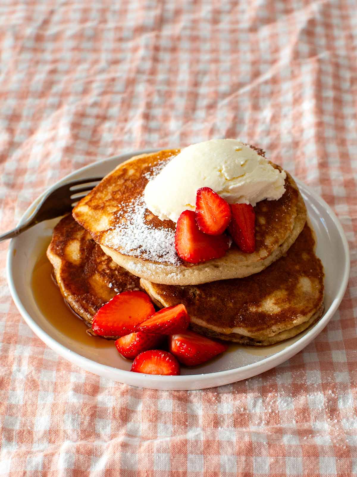 gluten free pancakes, strawberries, maple syrup and mascarpone