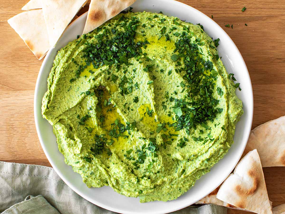 simple parsley hummus with olive oil and chopped parsley